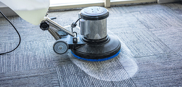A cleaning machine using dry foam to clean a dirty carpet.
